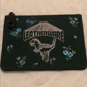 Brand new. Never used. Tags inside Coach pouch